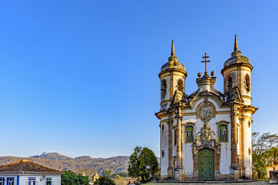 Low angle view of building against clear blue sky