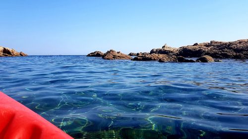 Scenic view of sea against clear blue sky