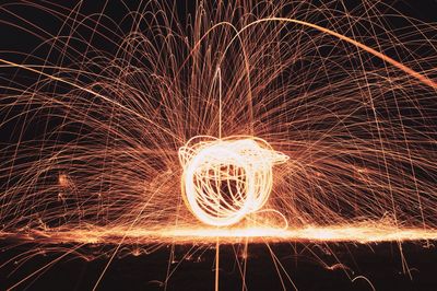 Spinning wire wool at night