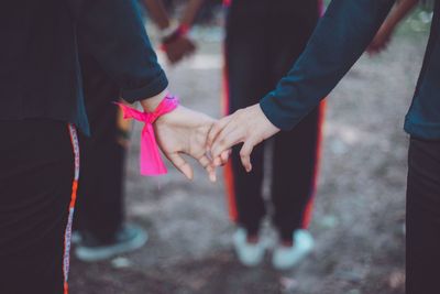 High angel view of friends holding holds