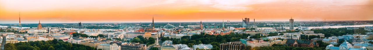 Panoramic view of cityscape against sky during sunset