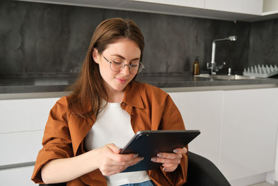 Young woman using mobile phone