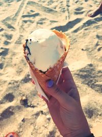 Midsection of person holding ice cream