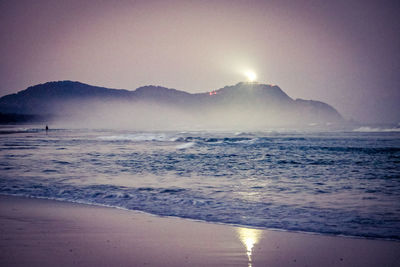 Scenic view of sea against clear sky during sunset