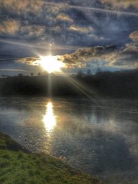 Scenic view of sunset over lake