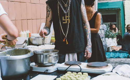 Group of people at market stall