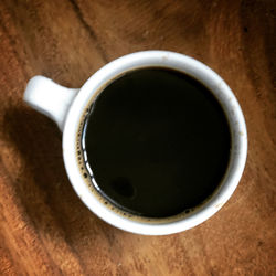 High angle view of coffee cup on table