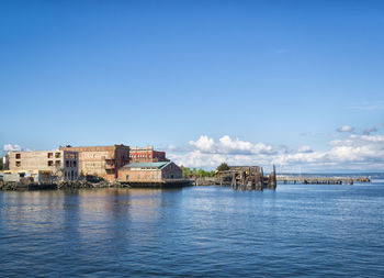 Scenic view of sea against blue sky