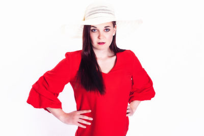 Portrait of beautiful young woman against white background