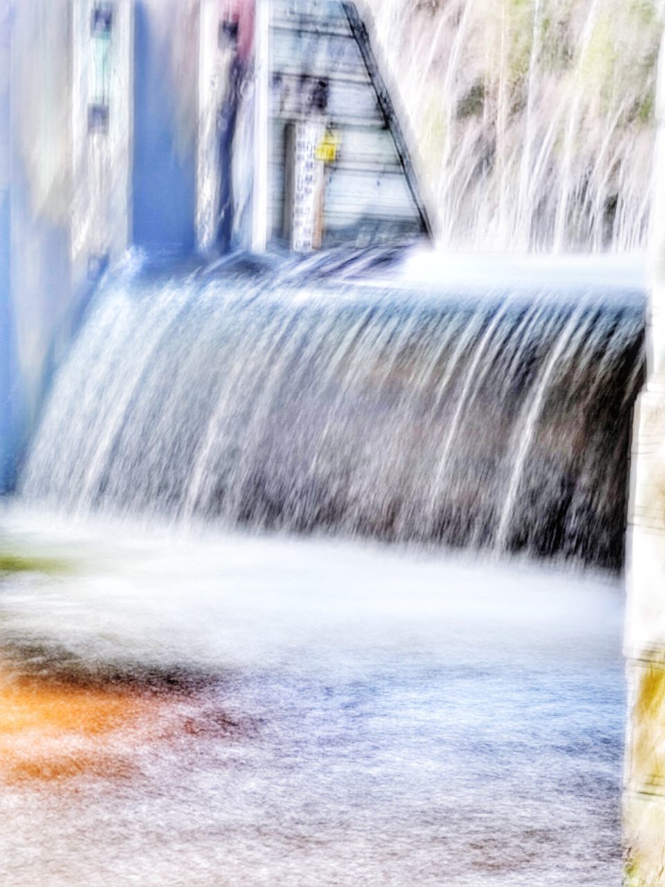 BLURRED MOTION OF WATER FLOWING FROM CAR