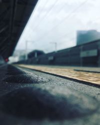 Surface level of railroad tracks against sky