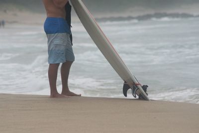 Low section of person on beach