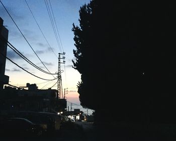 Low angle view of electricity pylon against sky