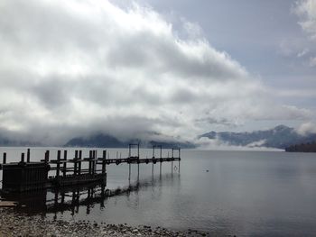 Pier on sea against sky