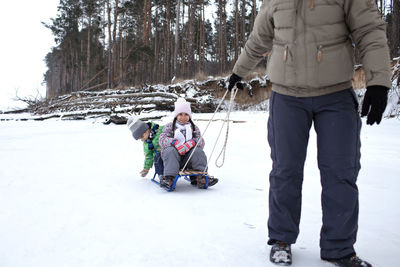 People on snow covered land