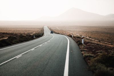 Empty road along landscape