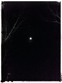 Low angle view of moon against sky at night