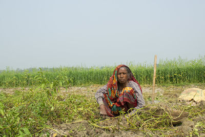 Woman working at agricultural field