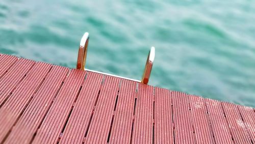 High angle view of railing against sea