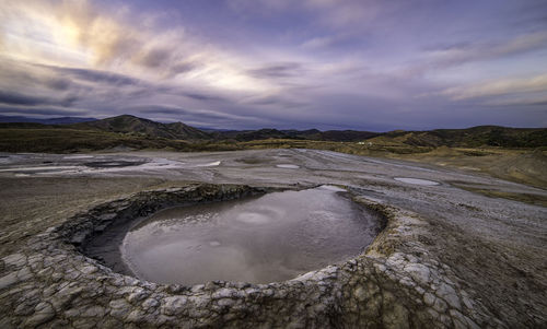 Scenic view of dramatic sky over landscape