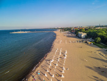 High angle view of beach against clear sky, aerial view on the pier in sopot, poland,