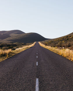 Road amidst landscape against clear sky