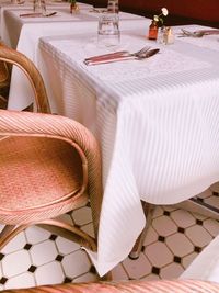 Empty chairs and tables in restaurant