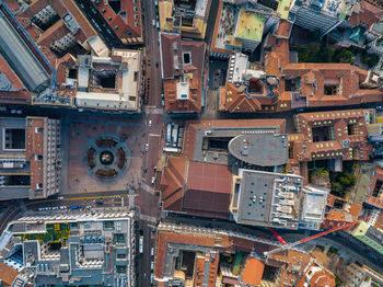 Aerial view of piazza duomo in front of the gothic cathedral in the center.