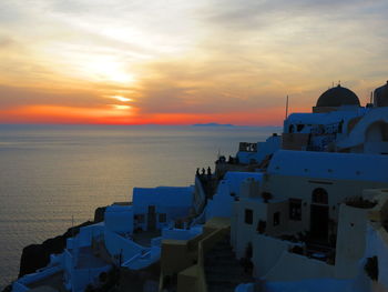 Buildings against sky during sunset