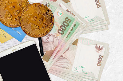 High angle view of coins on table