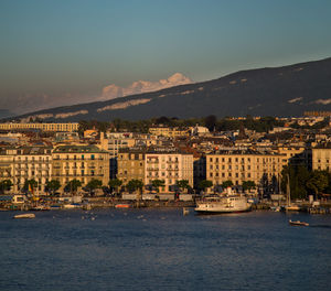 City at waterfront against sky