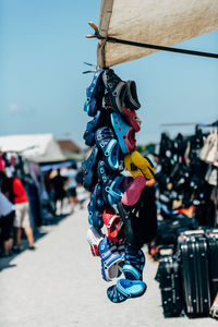 Clothes hanging on street at market