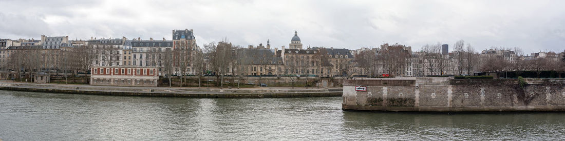 View of buildings against cloudy sky