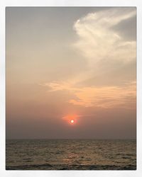 Scenic view of sea against sky at sunset