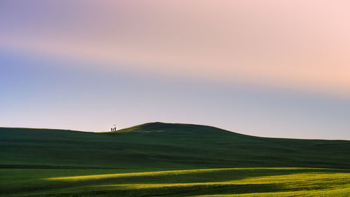 Scenic view of landscape against sky during sunset