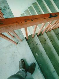 Low section of man standing on floor