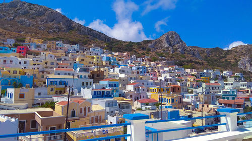 Houses in town against blue sky