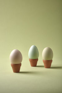 Close-up of cups against white background