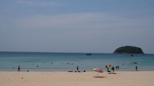 High angle view of people at beach against sky