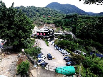 High angle view of road by trees and mountains