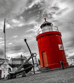 View of lighthouse against cloudy sky