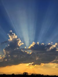 Low angle view of dramatic sky during sunset