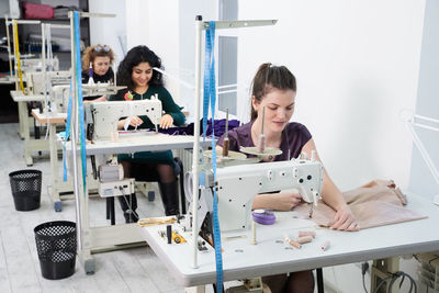 Women working on sewing machine