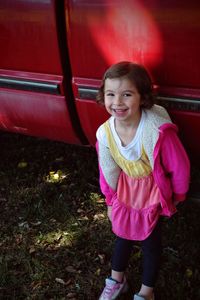 Portrait of cute girl standing outdoors