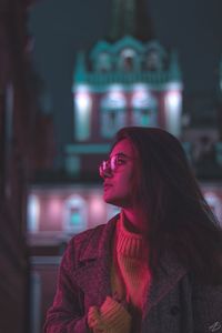 Portrait of a young woman looking away