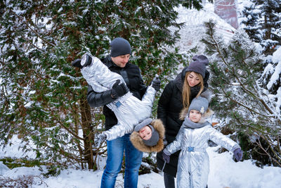 Full length of woman standing on snow