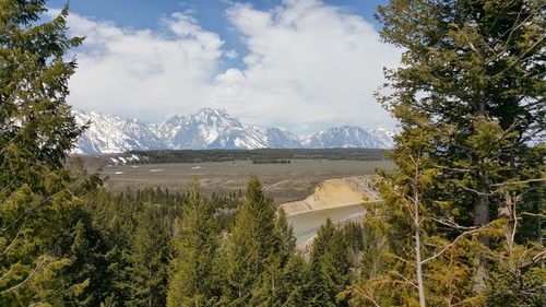 Scenic view of mountains against cloudy sky