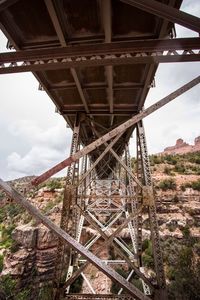 Low angle view of old bridge against sky