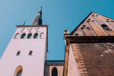 Low angle view of building against clear blue sky