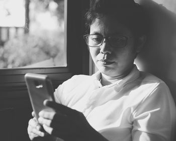 Close-up of woman using mobile phone